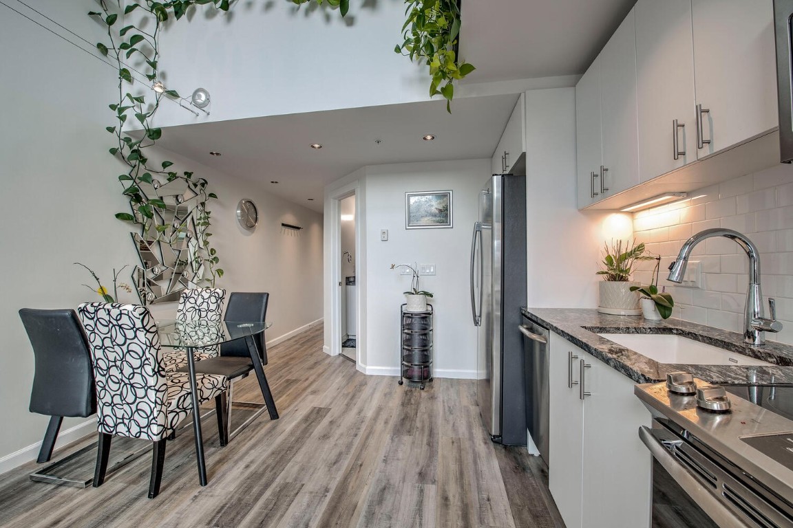 100 Basecamp Way, Unit 217 Frisco, CO 80443 - Photo 7 of 39 a view of a kitchen with a table and chairs