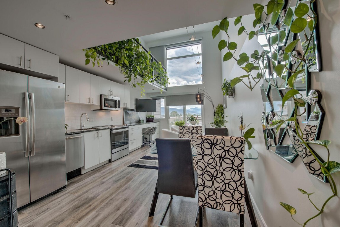 100 Basecamp Way, Unit 217 Frisco, CO 80443 - Photo 9 of 39 a kitchen with a table and chairs
