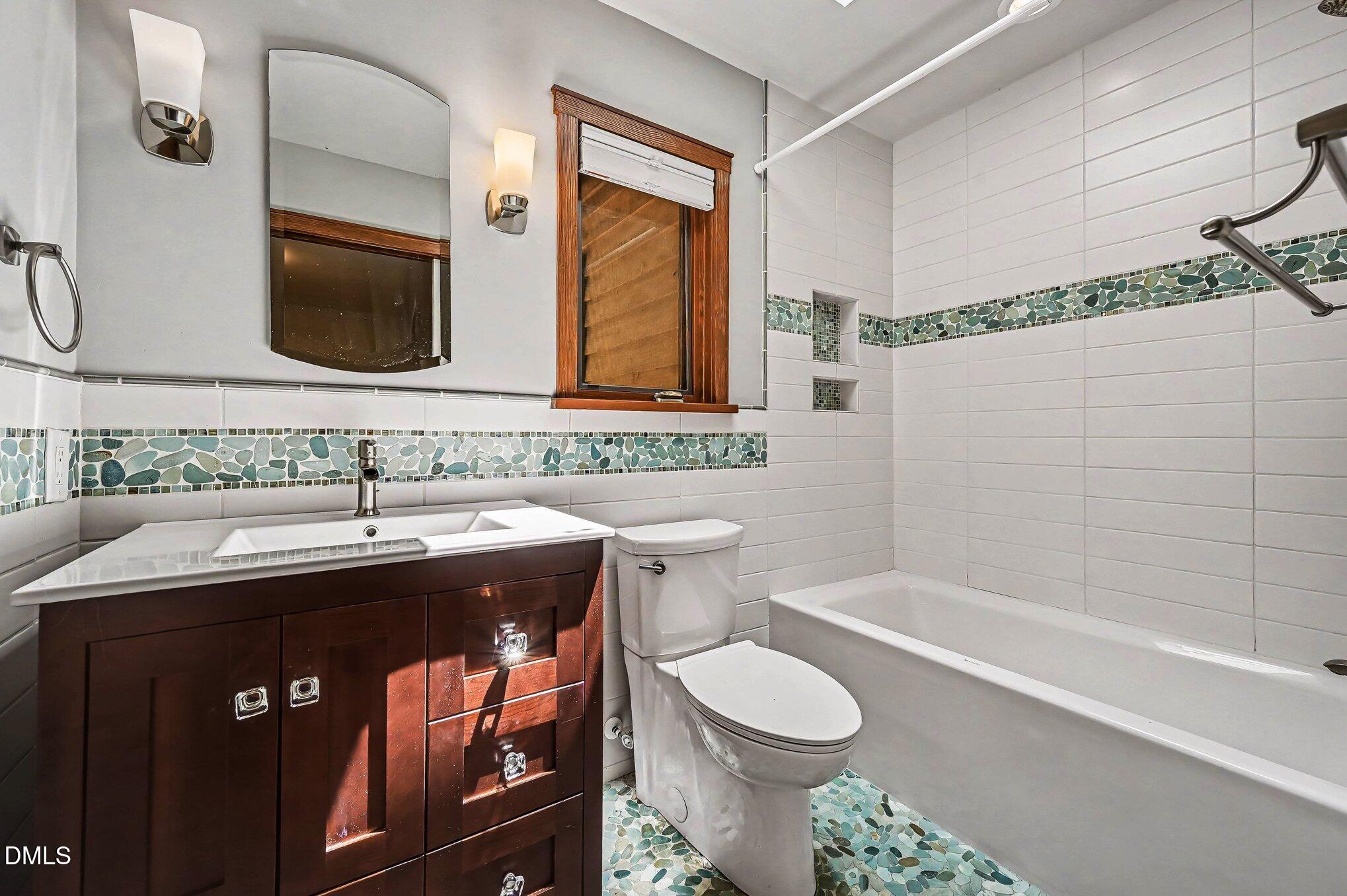 200 Spring Valley Road Carrboro, NC 27510 - Photo 18 of 38 a bathroom with a granite countertop sink toilet and shower