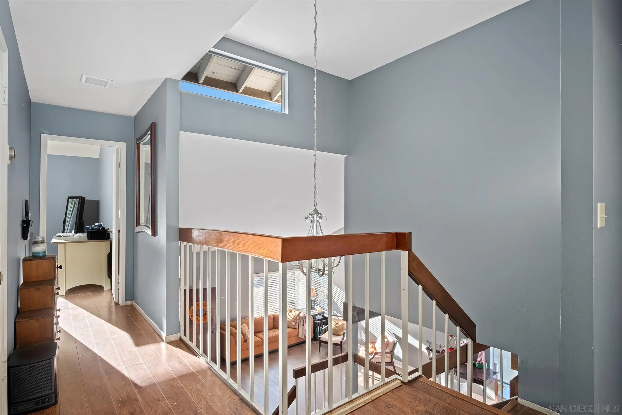 330 Rock Ridge Place Escondido, CA 92027 - Photo 13 of 32 a view of a hallway with windows and stairs