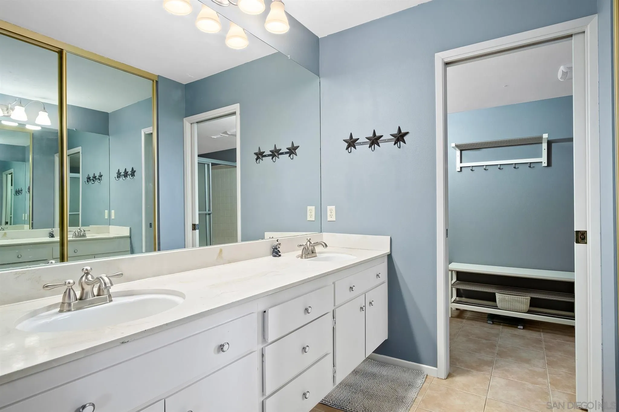 330 Rock Ridge Place Escondido, CA 92027 - Photo 16 of 32 a bathroom with a double vanity sink and a mirror