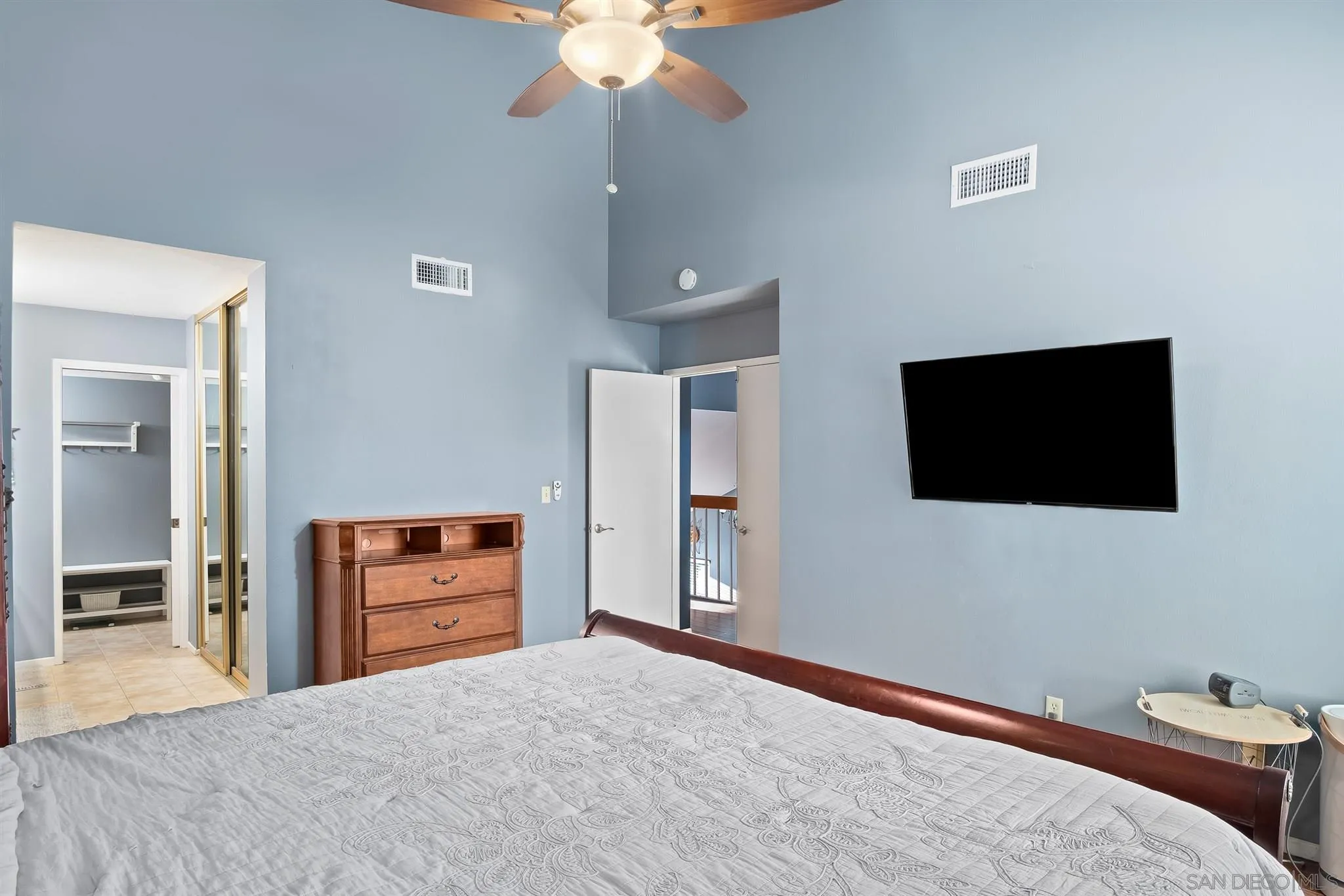 330 Rock Ridge Place Escondido, CA 92027 - Photo 19 of 32 a bedroom with a bed and a flat screen tv