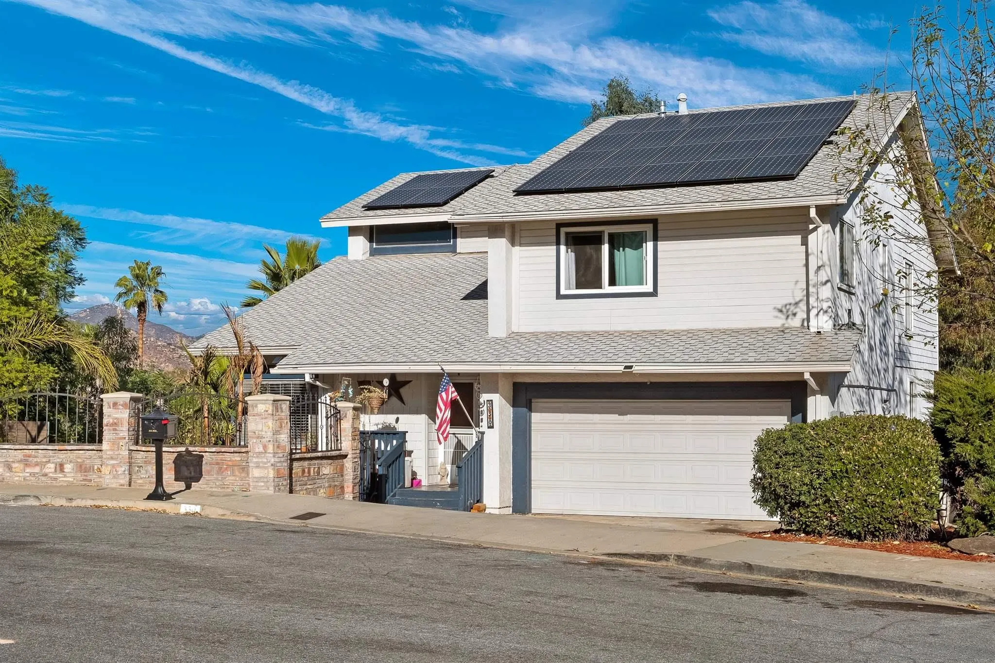 330 Rock Ridge Place Escondido, CA 92027 - Photo 2 of 32 a front view of a house with a garage