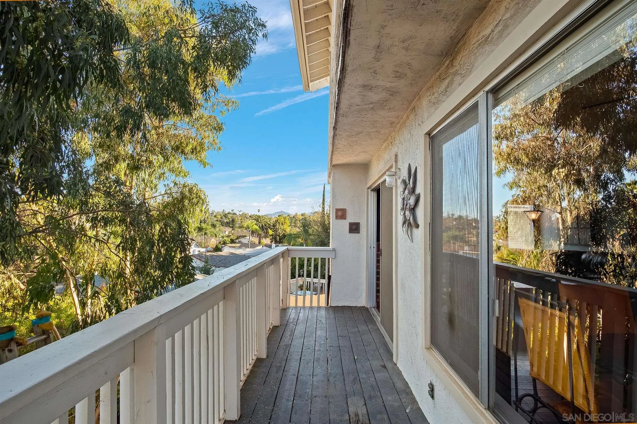 330 Rock Ridge Place Escondido, CA 92027 - Photo 25 of 32 a view of a balcony with wooden floor and fence