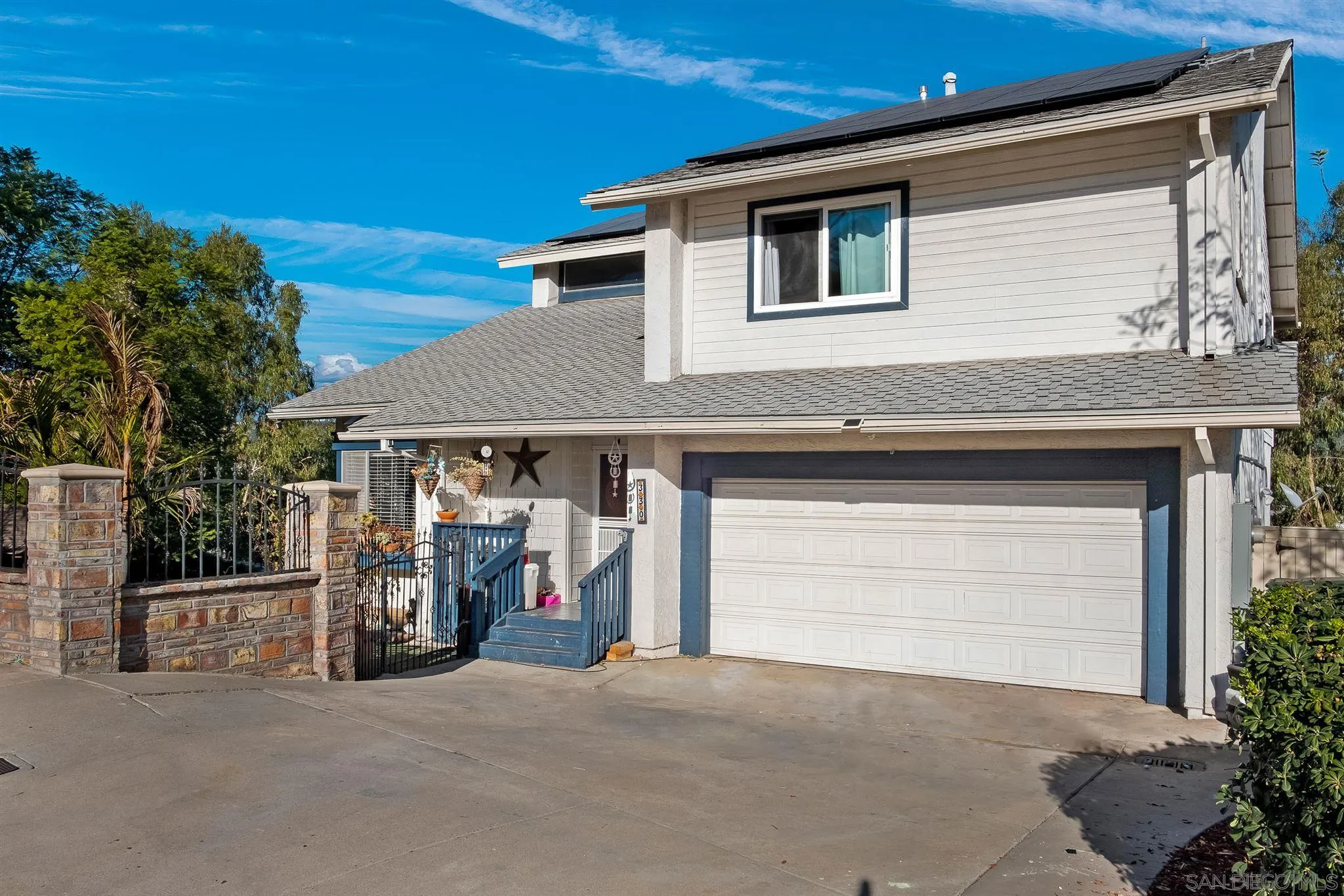 330 Rock Ridge Place Escondido, CA 92027 - Photo 29 of 32 a front view of a house with a garage