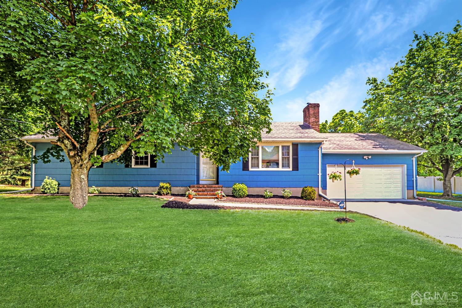 434 Hoffman Station Road Monroe Township, NJ 08831 - Photo 1 of 36 a house view with a sitting space and garden