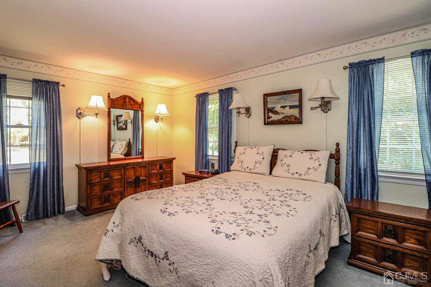 434 Hoffman Station Road Monroe Township, NJ 08831 - Photo 17 of 36 a bedroom with a bed and a dresser