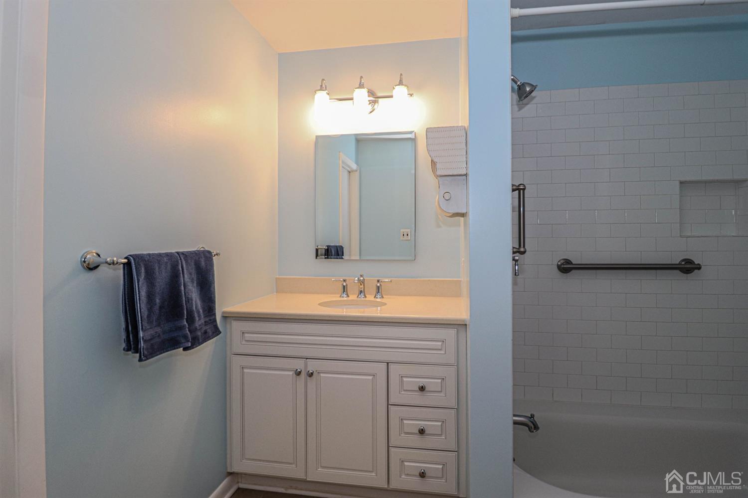 434 Hoffman Station Road Monroe Township, NJ 08831 - Photo 21 of 36 a bathroom with a sink and a mirror