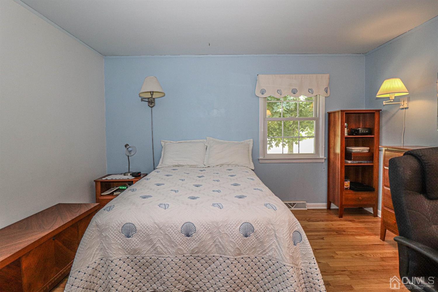 434 Hoffman Station Road Monroe Township, NJ 08831 - Photo 22 of 36 a bedroom with a bed and a cabinets