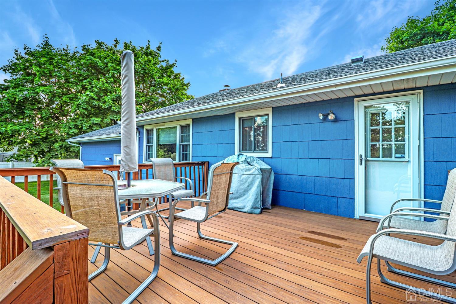 434 Hoffman Station Road Monroe Township, NJ 08831 - Photo 25 of 36 a view of a dinning tables and chairs in patio of the house