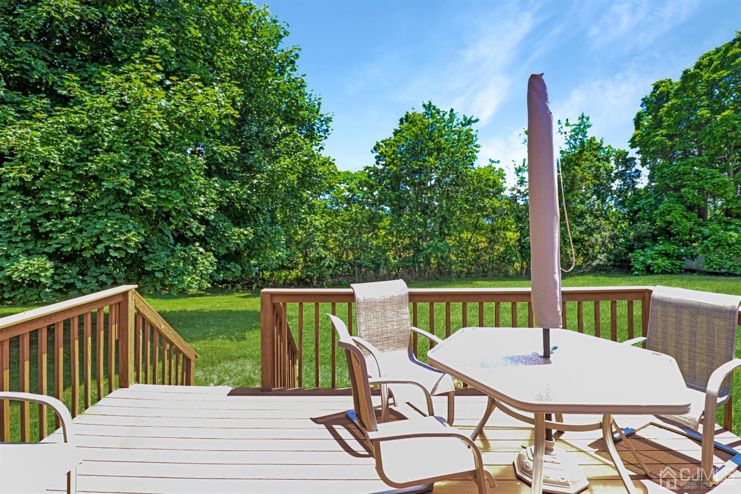 434 Hoffman Station Road Monroe Township, NJ 08831 - Photo 26 of 36 a view of a table and chairs on the roof deck