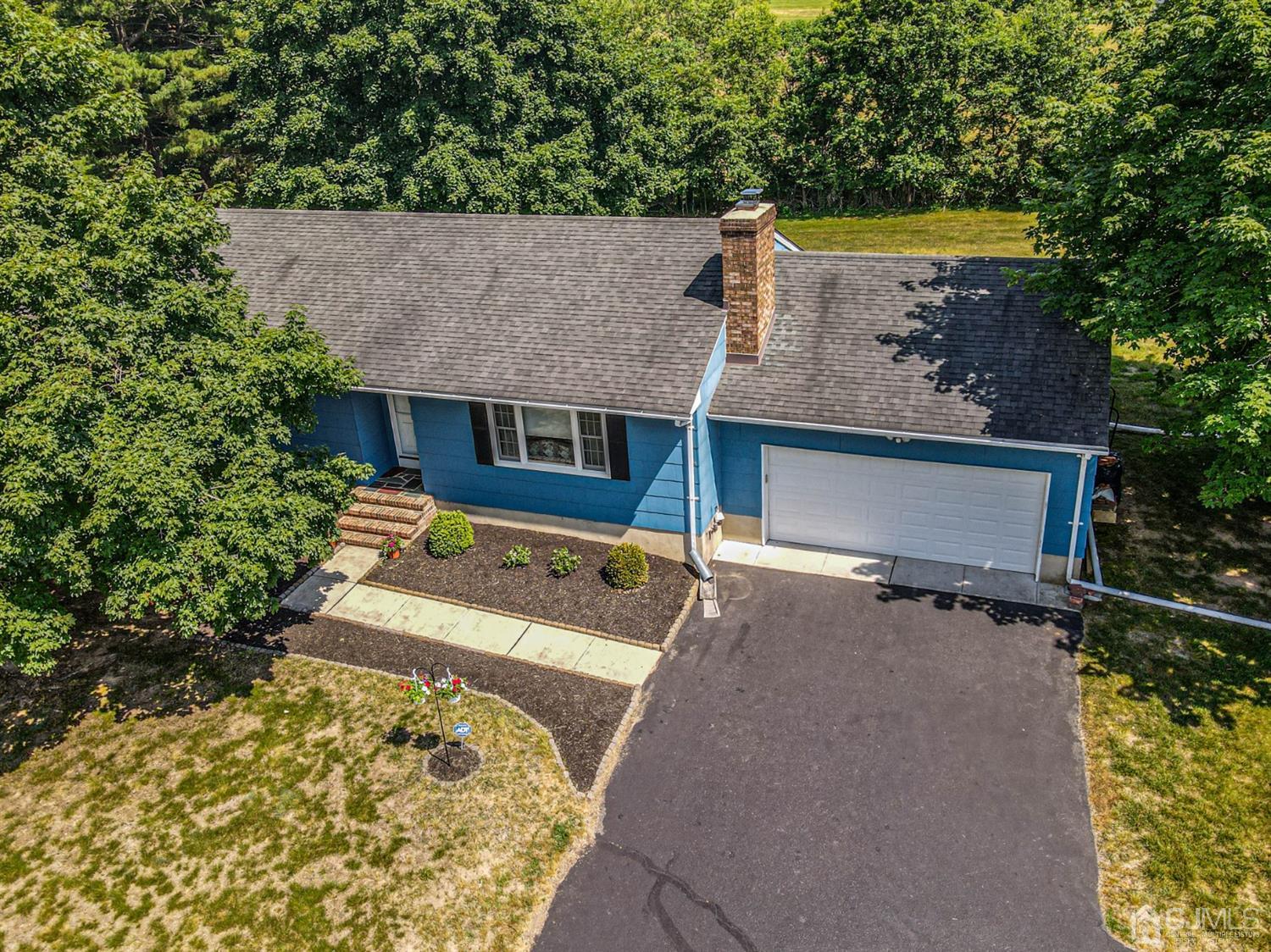 434 Hoffman Station Road Monroe Township, NJ 08831 - Photo 32 of 36 an aerial view of a house with a yard and a patio