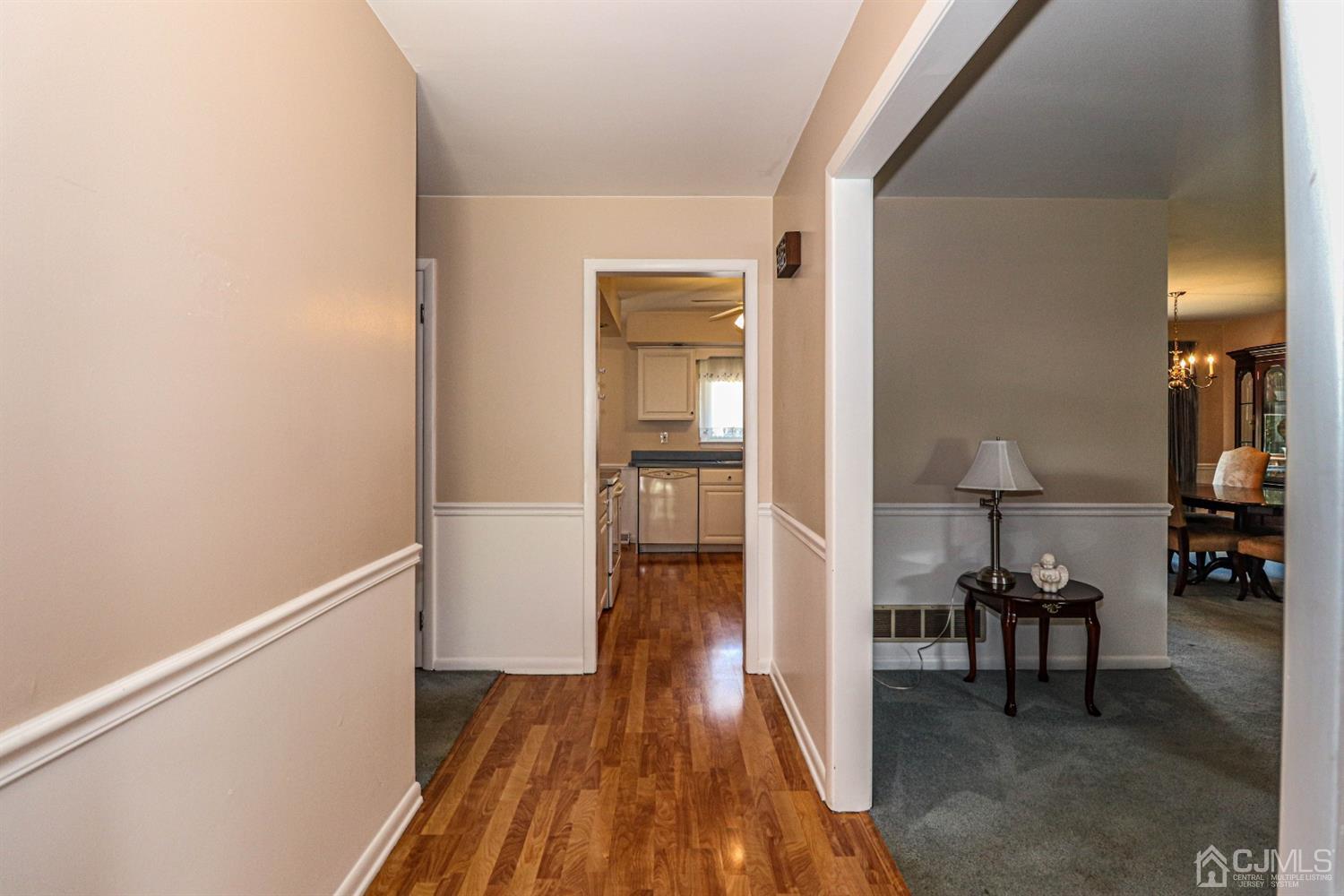 434 Hoffman Station Road Monroe Township, NJ 08831 - Photo 7 of 36 a view of a hallway and wooden floor an entryway
