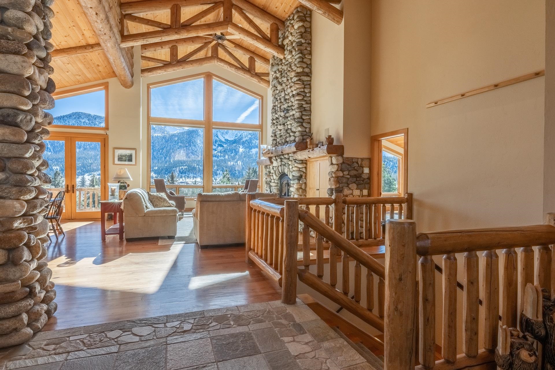 91 Ridge Way Mammoth Lakes, CA 93546 - Photo 3 of 49 a view of a balcony with wooden floor and furniture