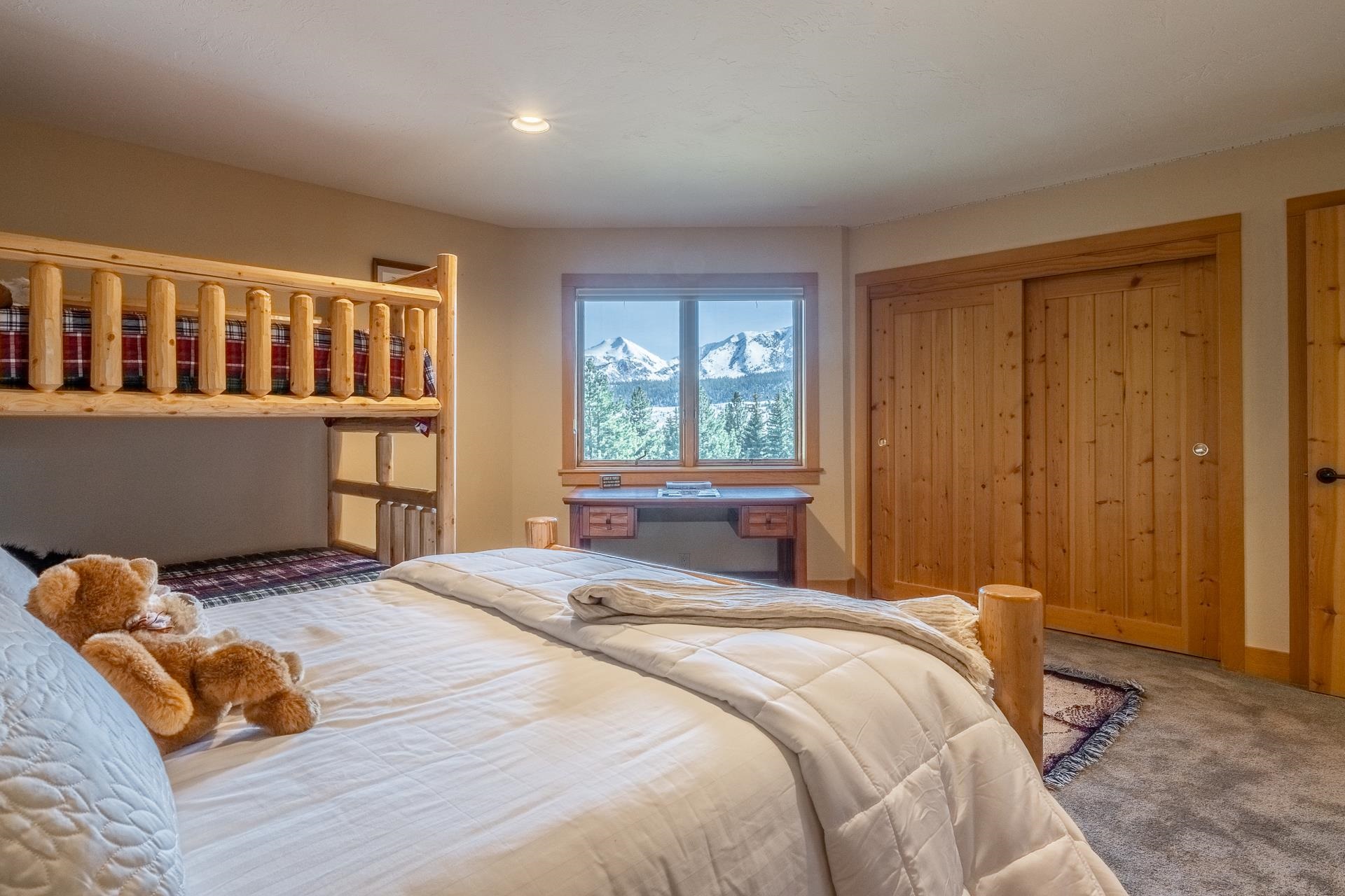 91 Ridge Way Mammoth Lakes, CA 93546 - Photo 32 of 49 a bedroom with a bed and a window