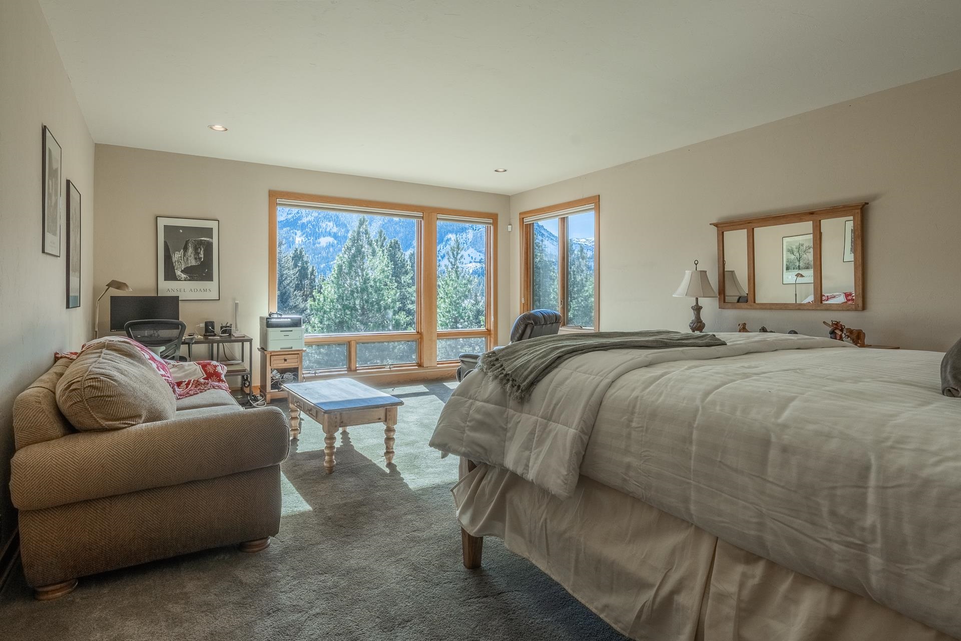 91 Ridge Way Mammoth Lakes, CA 93546 - Photo 34 of 49 a spacious bedroom with a bed and a couch