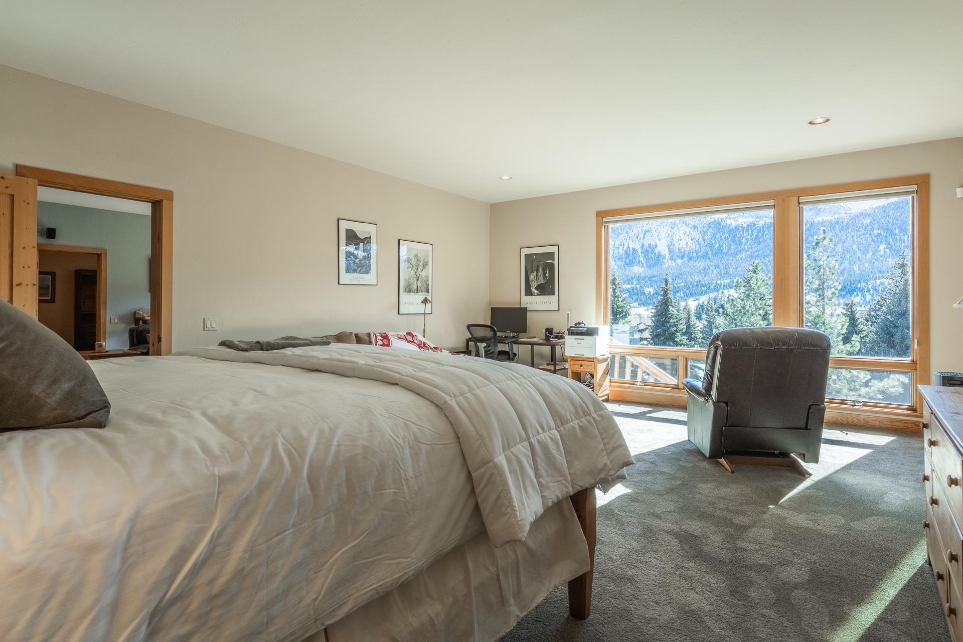 91 Ridge Way Mammoth Lakes, CA 93546 - Photo 36 of 49 a spacious bedroom with a large bed and a large window