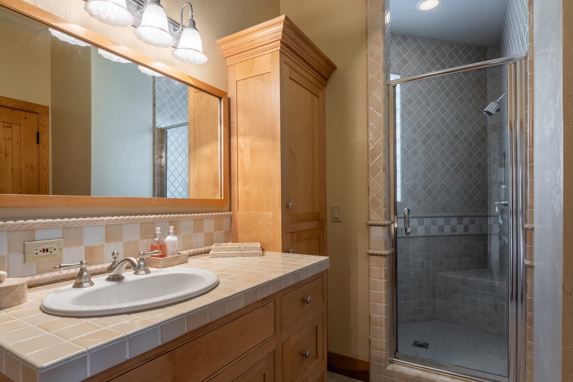 91 Ridge Way Mammoth Lakes, CA 93546 - Photo 40 of 49 a bathroom with a sink and a mirror