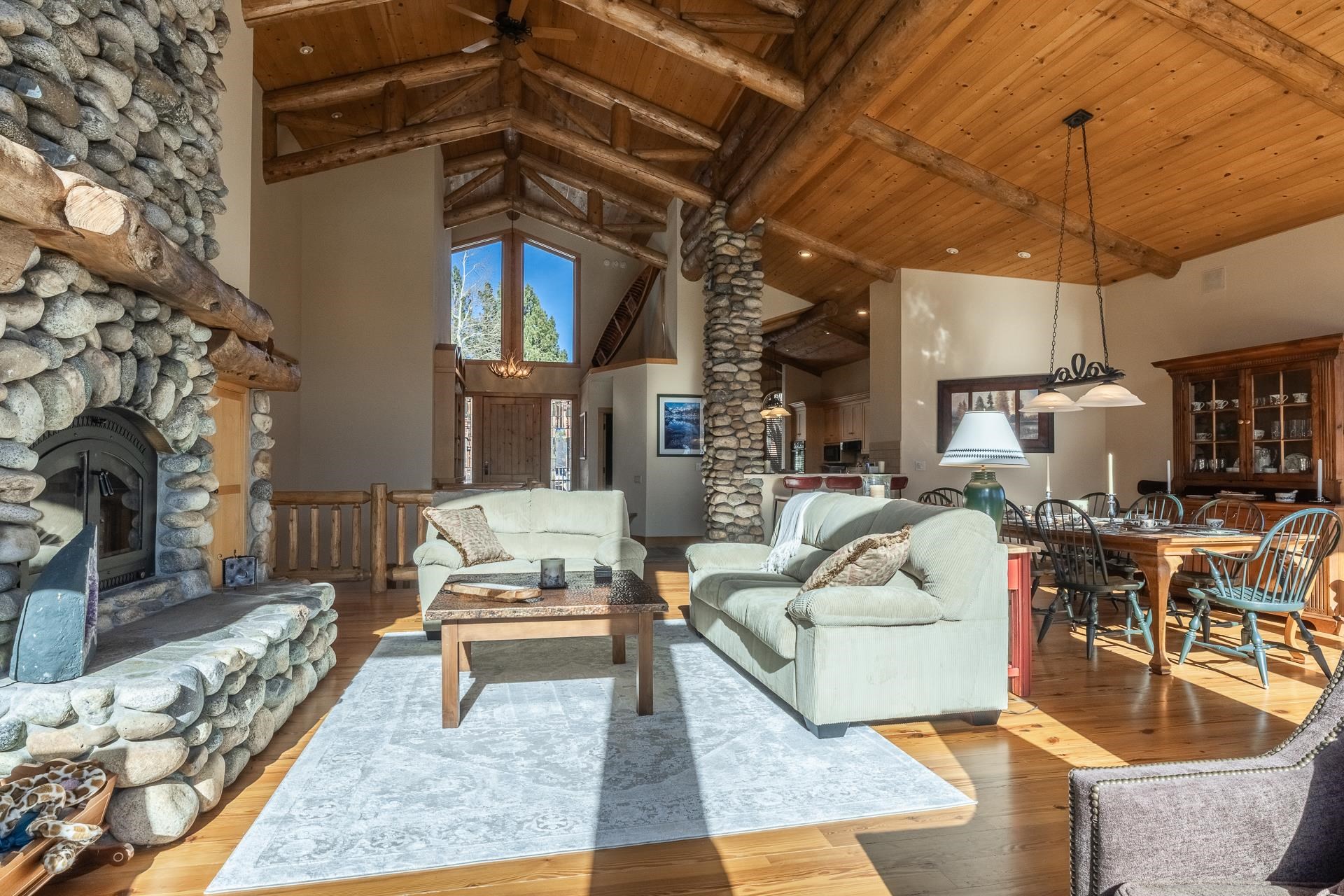 91 Ridge Way Mammoth Lakes, CA 93546 - Photo 5 of 49 a living room with furniture a fireplace and a chandelier