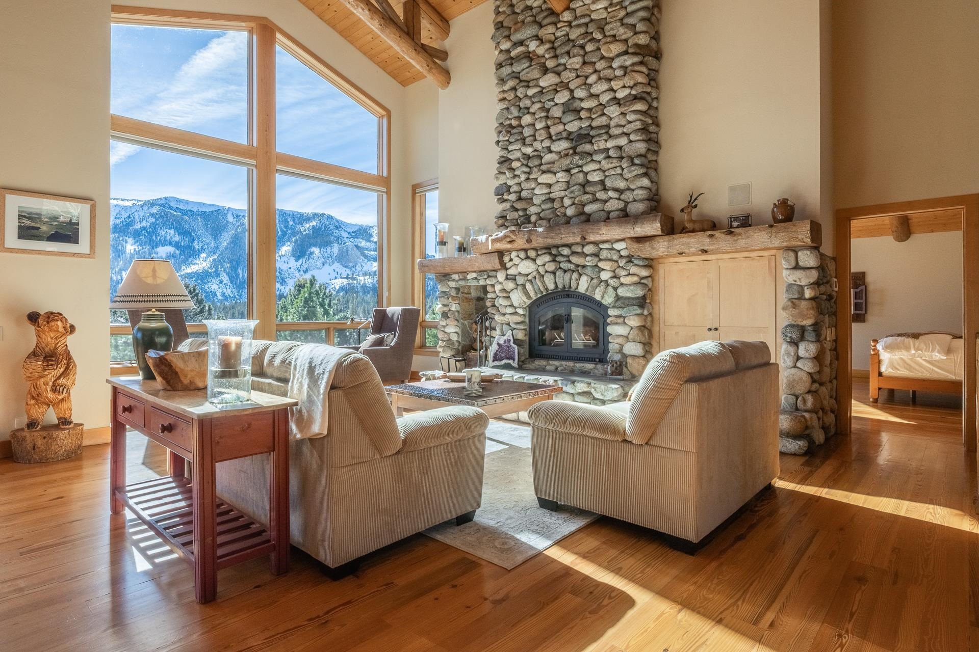 91 Ridge Way Mammoth Lakes, CA 93546 - Photo 7 of 49 a living room with furniture a large window and a fireplace