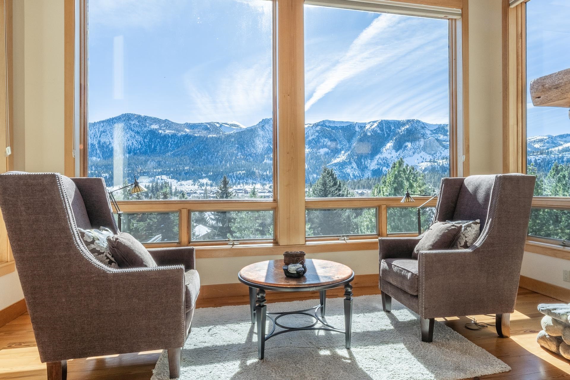 91 Ridge Way Mammoth Lakes, CA 93546 - Photo 9 of 49 a living room with furniture a table and a large window
