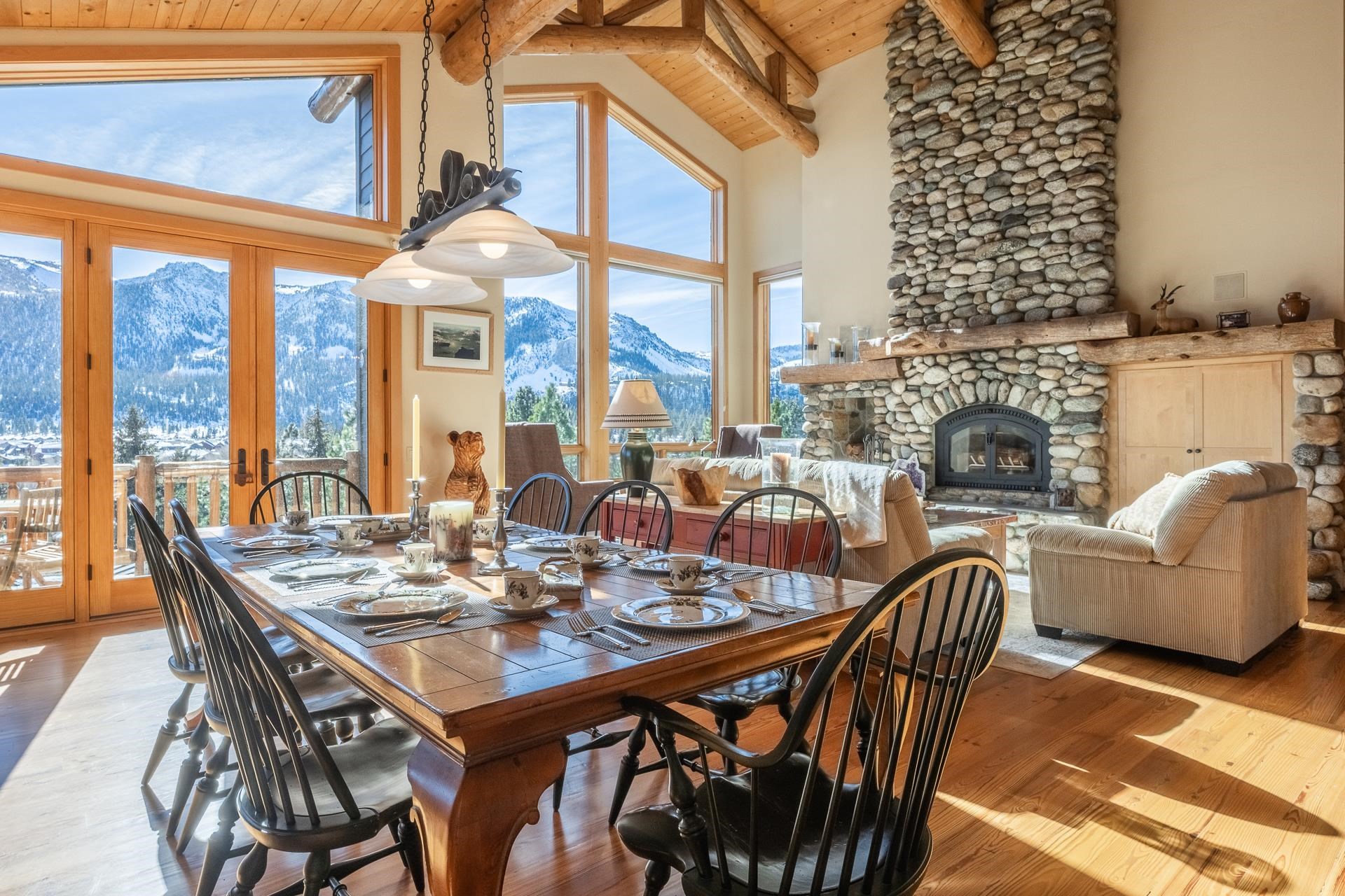 91 Ridge Way Mammoth Lakes, CA 93546 - Photo 10 of 49 a dining room with furniture a chandelier and a rug