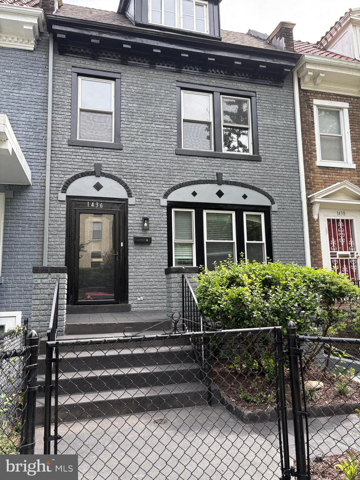 a front view of a house with stairs