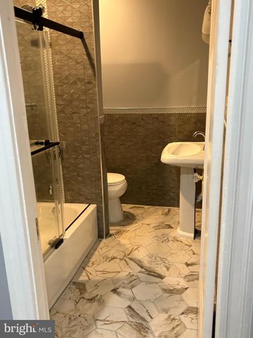 a bathroom with a sink and a shower