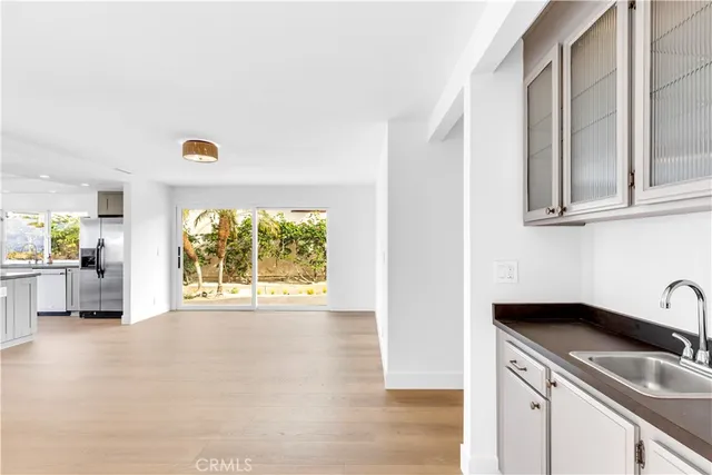 a kitchen with a sink cabinets and window