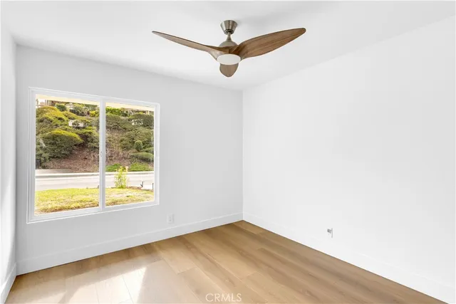 a view of an empty room and a window