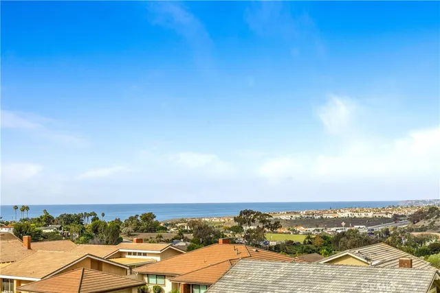 an aerial view of residential building and ocean view