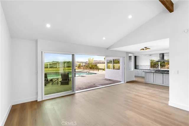 a view of kitchen with furniture and floor to ceiling window