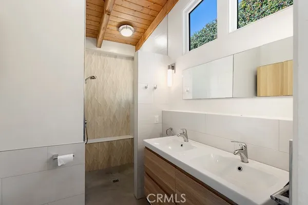 a bathroom with a sink and mirror