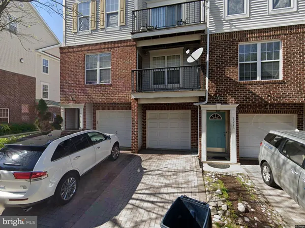 a front view of a house with parking space