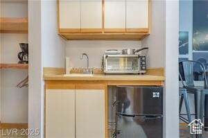 223 Hunter Road, Unit B303 Brian Head, UT 84719 - Photo 16 of 49 Kitchen with light countertops and white cabinets