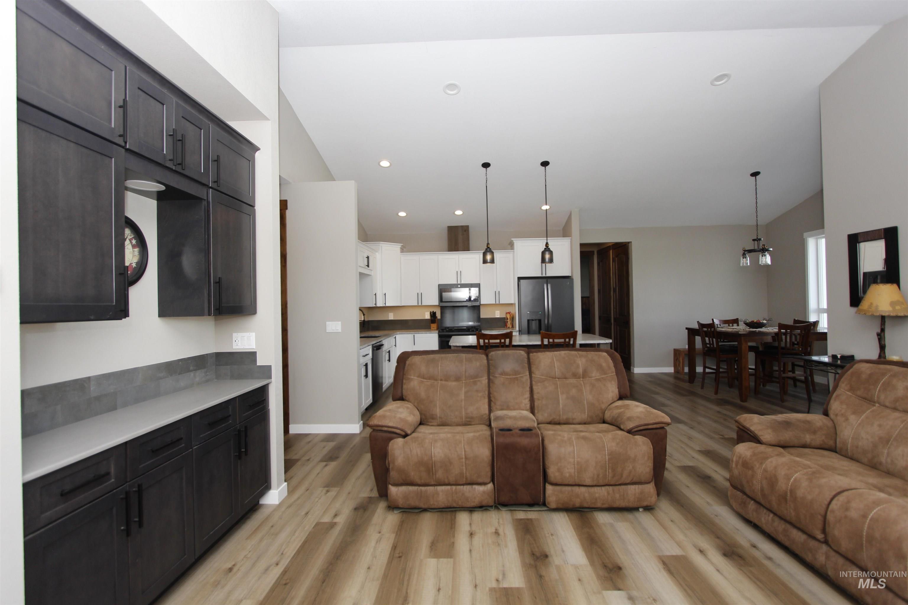 2013 Cedar Avenue Lewiston, ID 83501 - Photo 13 of 46 Living area featuring lofted ceiling, light wood-type flooring, and recessed lighting