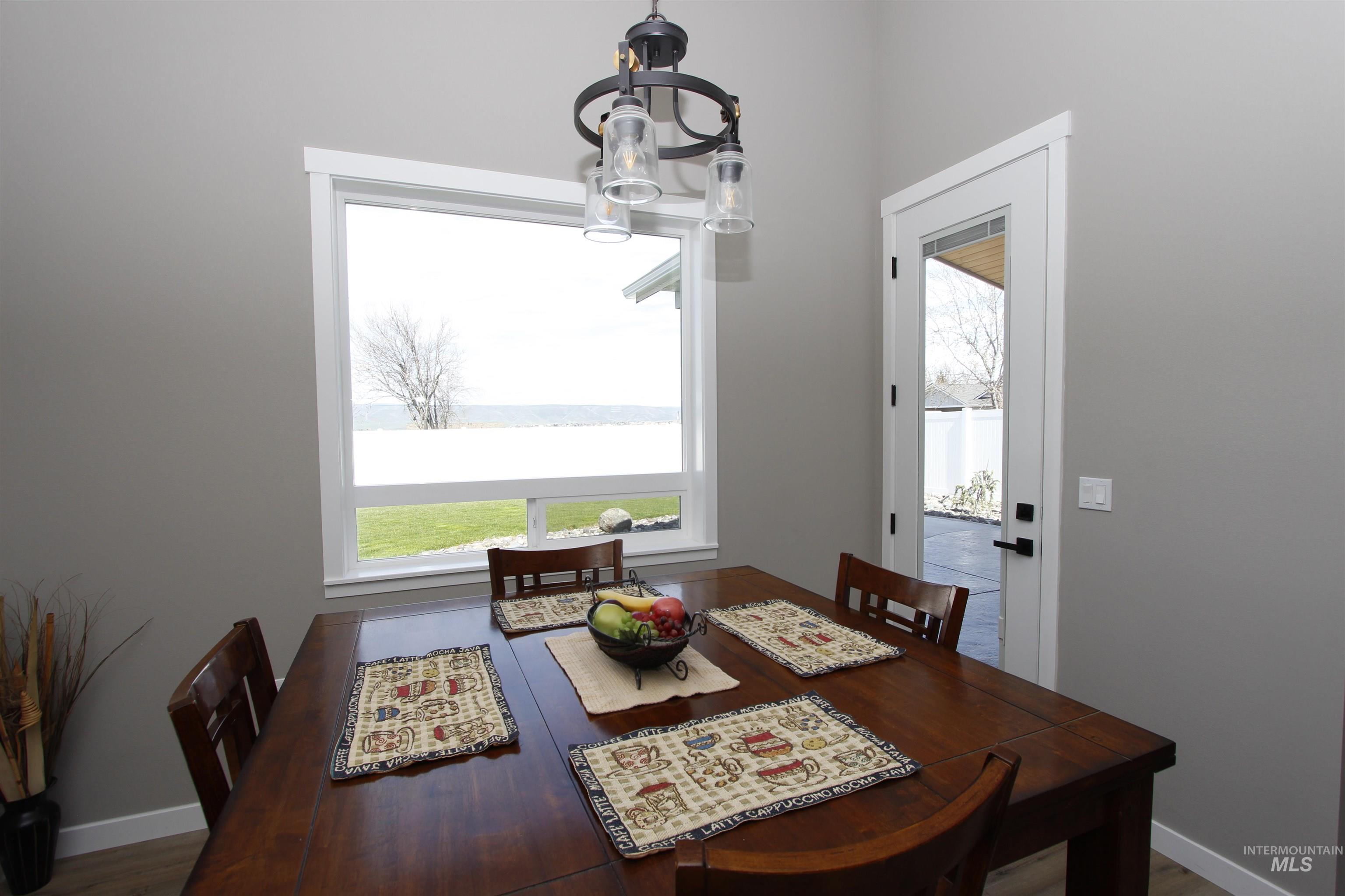 2013 Cedar Avenue Lewiston, ID 83501 - Photo 17 of 46 Dining area featuring baseboards and dark wood-type flooring