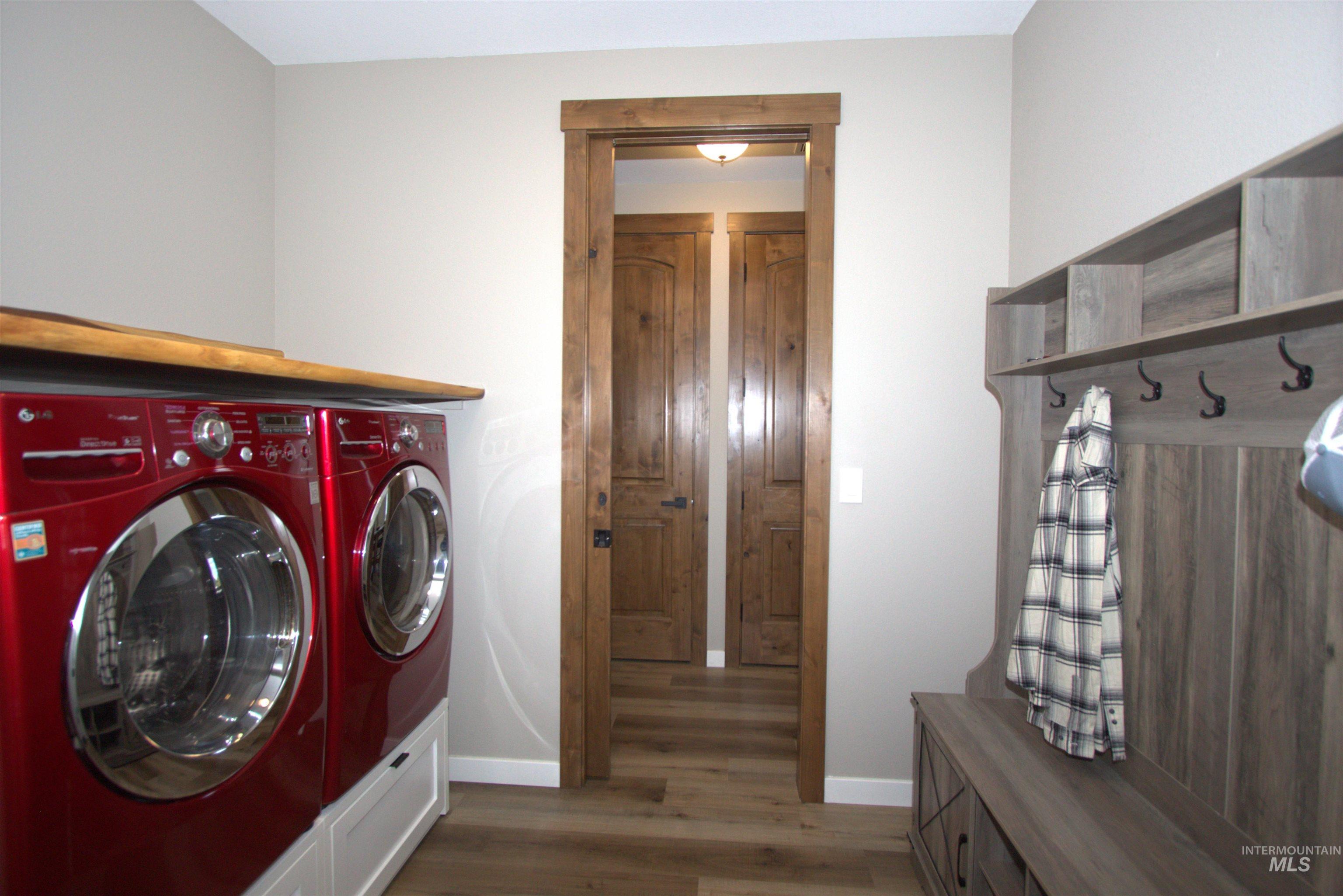2013 Cedar Avenue Lewiston, ID 83501 - Photo 18 of 46 Laundry room with dark wood-style flooring and washing machine and clothes dryer