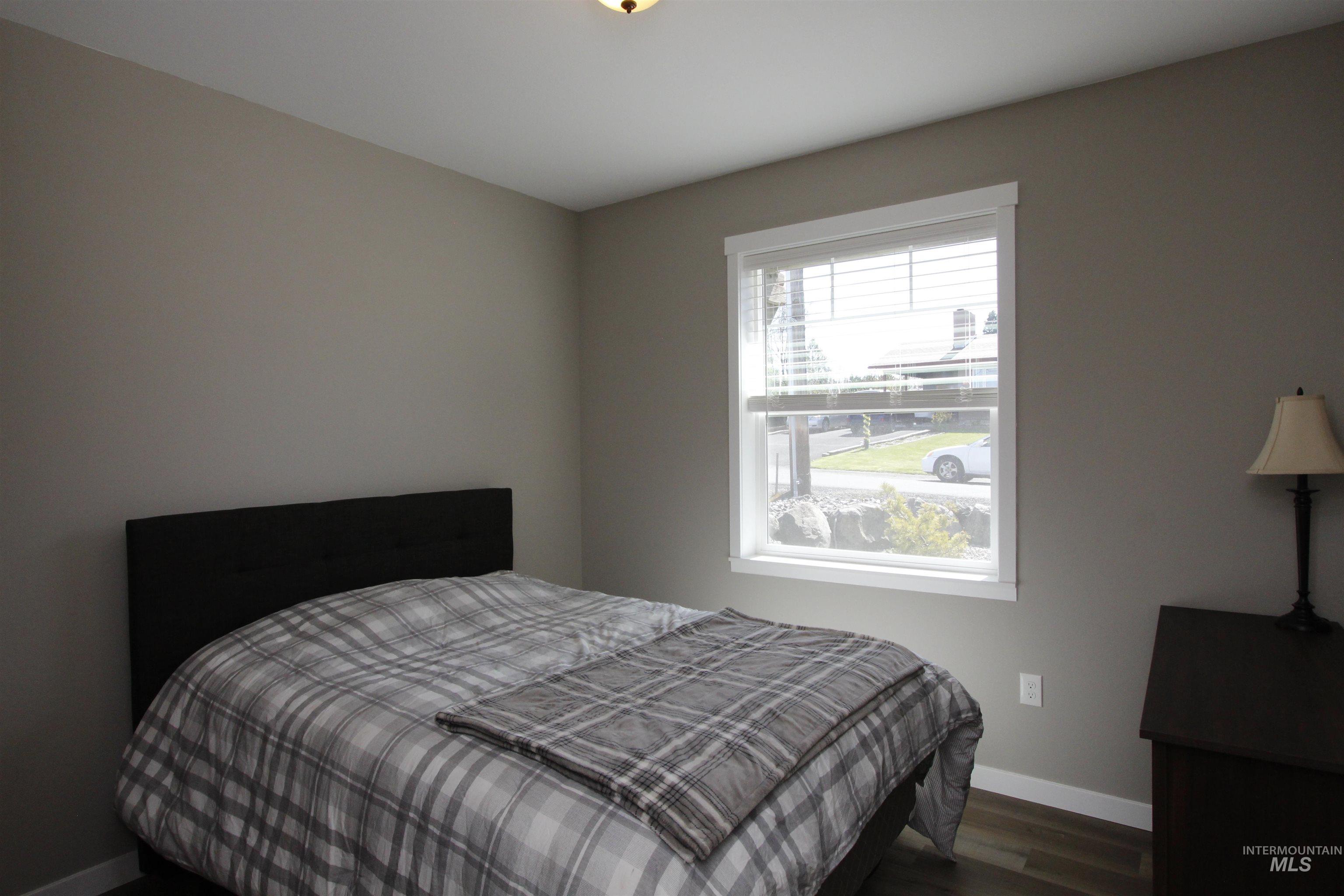 2013 Cedar Avenue Lewiston, ID 83501 - Photo 26 of 46 Bedroom featuring baseboards and wood finished floors