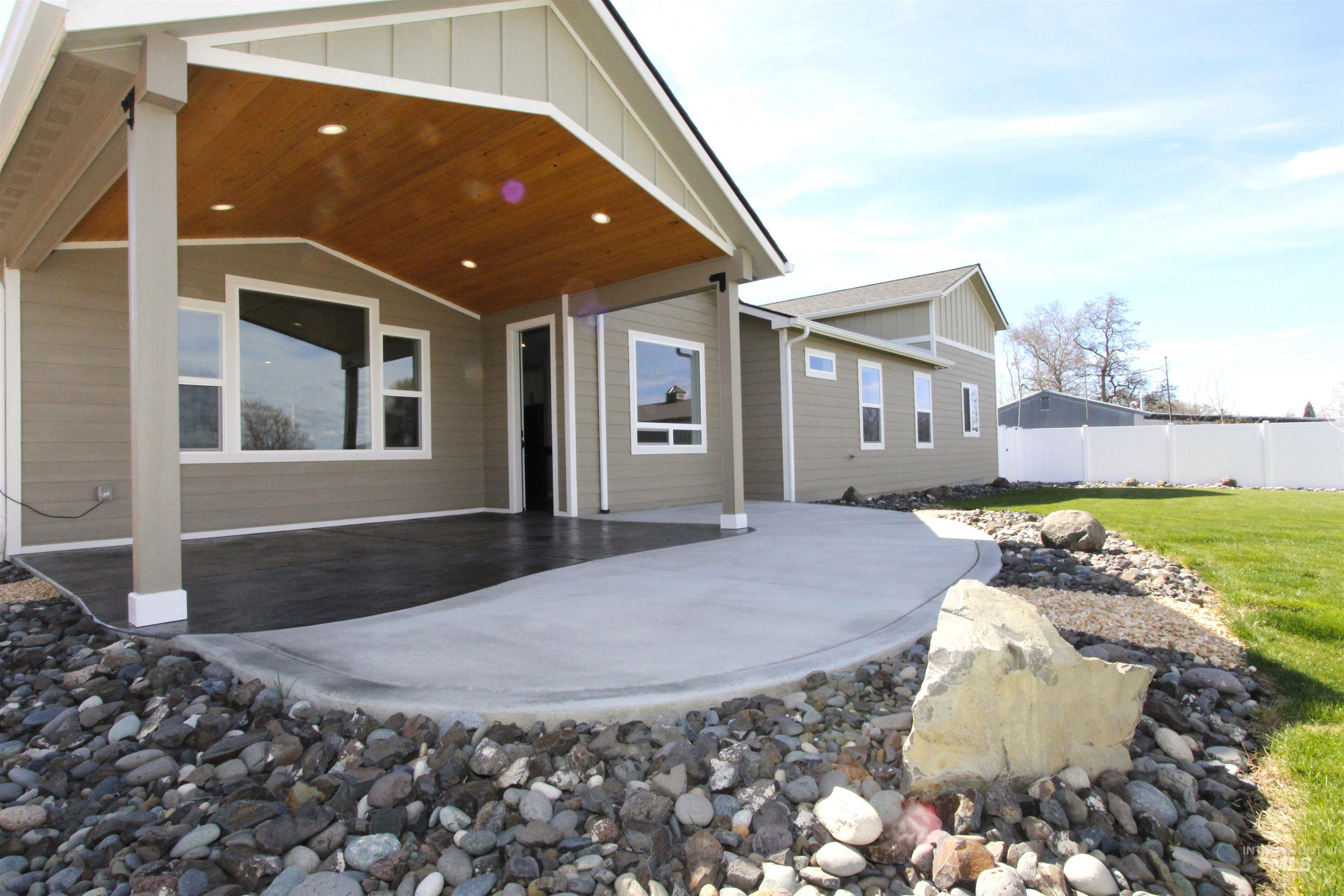 2013 Cedar Avenue Lewiston, ID 83501 - Photo 31 of 46 Back of property with board and batten siding and a patio area