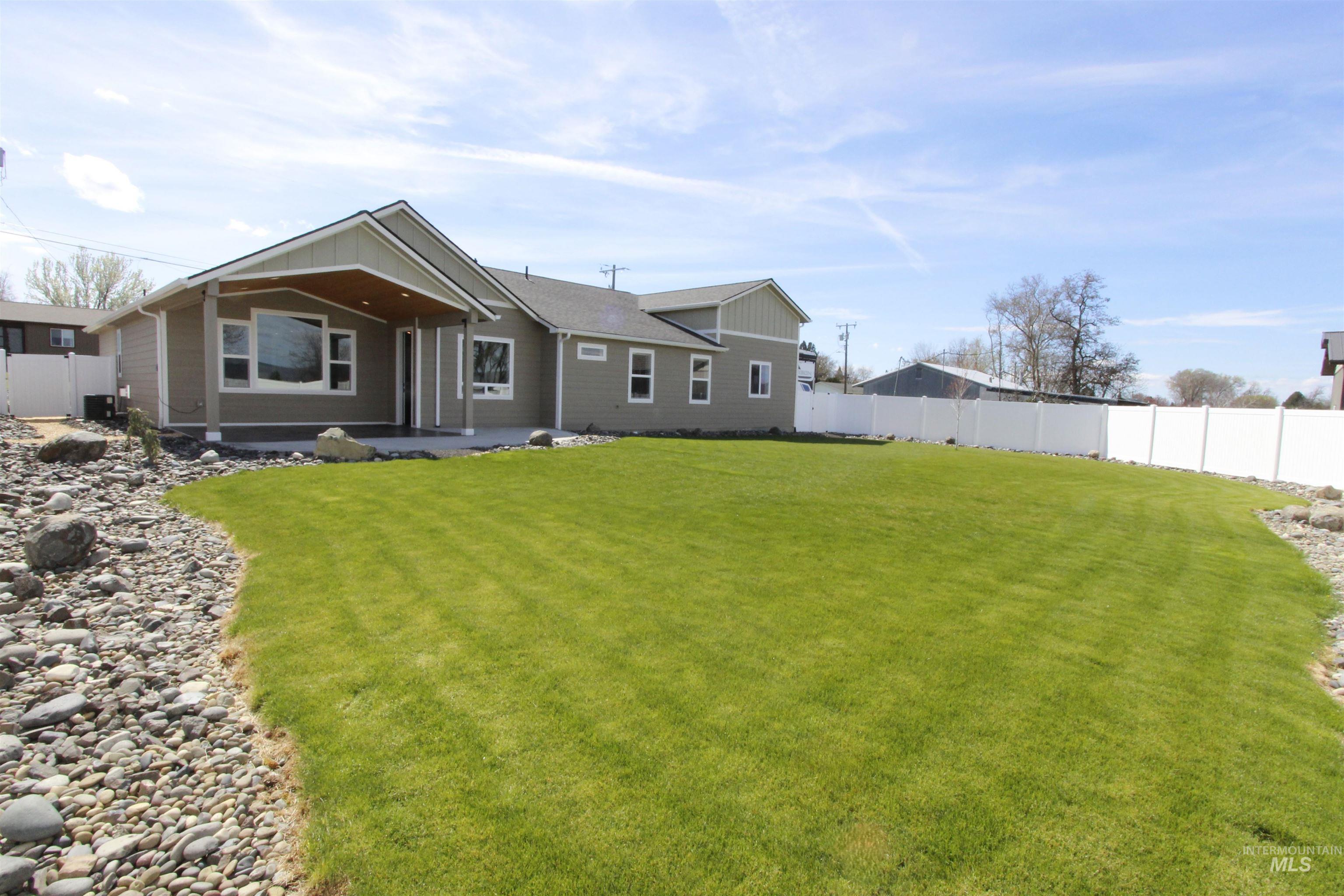 2013 Cedar Avenue Lewiston, ID 83501 - Photo 32 of 46 Rear view of house featuring a fenced backyard and a patio