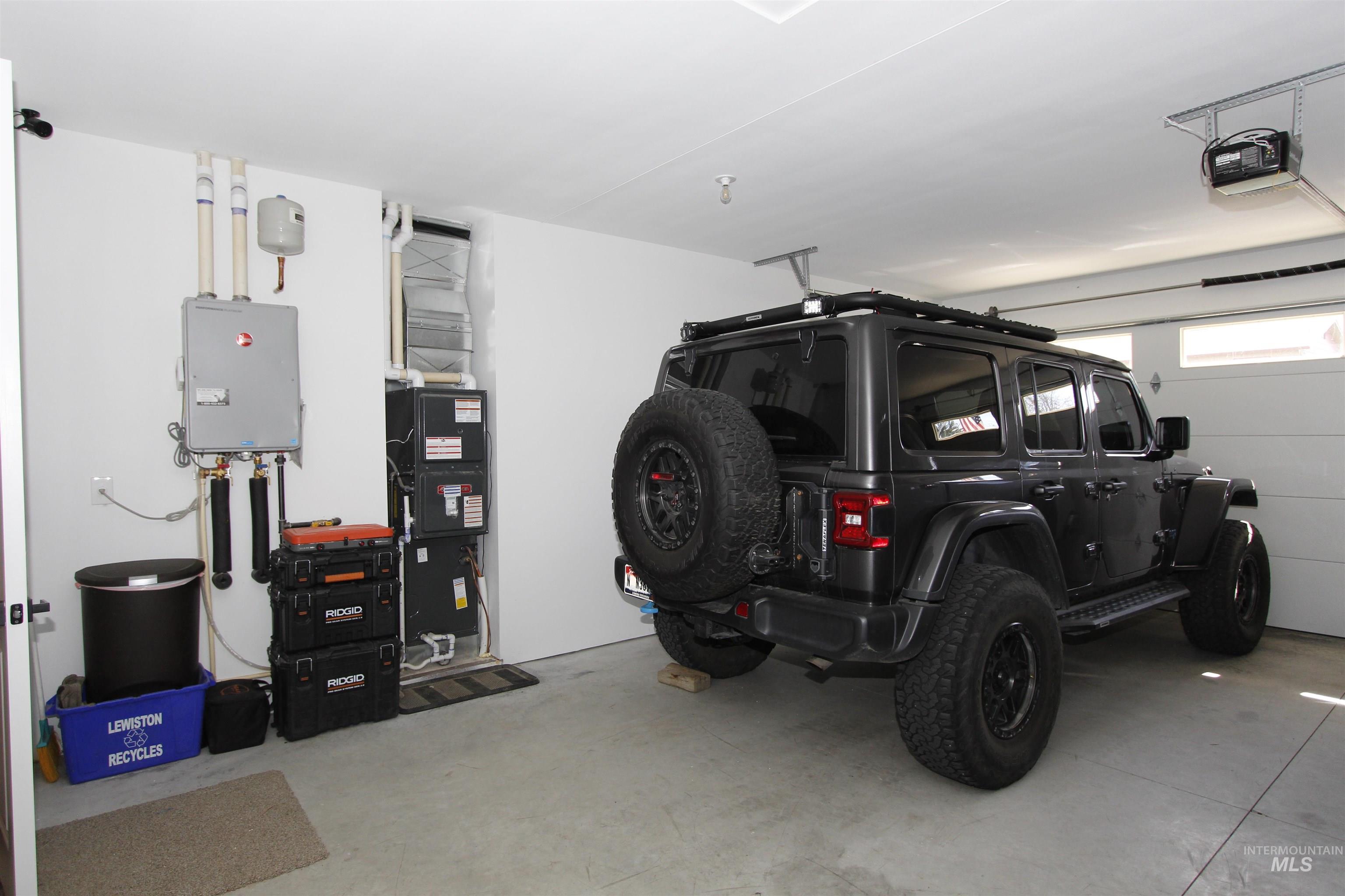 2013 Cedar Avenue Lewiston, ID 83501 - Photo 37 of 46 Garage with a garage door opener and heating unit