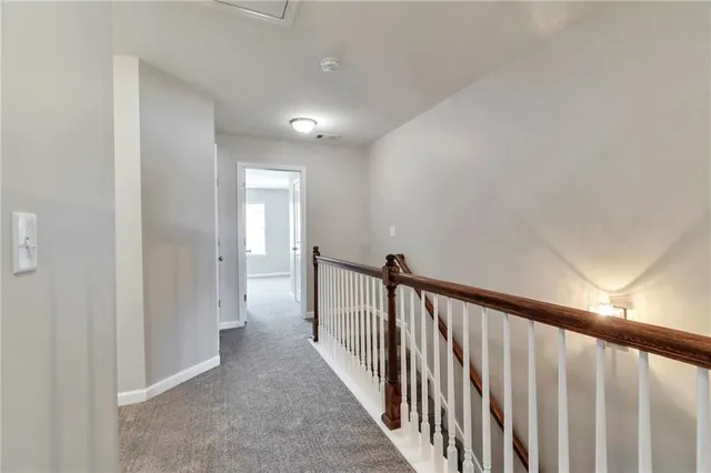 a view of a hallway with a window