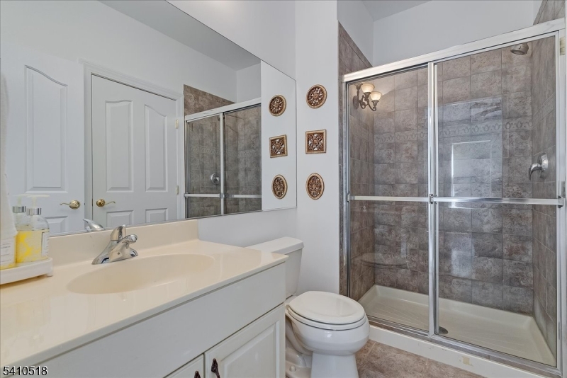 1 Brodziak Road Denville, NJ 07834 - Photo 27 of 42 a bathroom with a sink toilet and shower