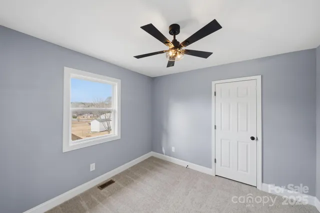 a view of a big room with wooden floor and closet
