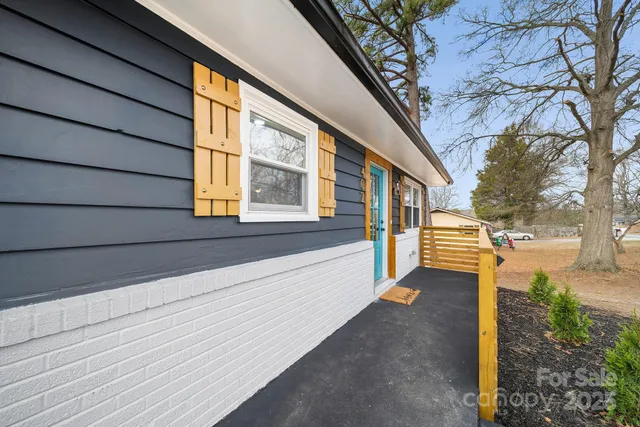 a view of a house with a street