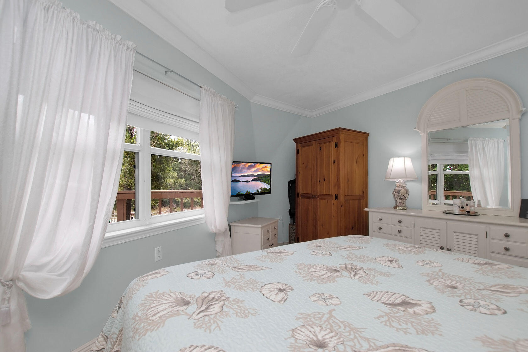 676 Sailfish Trail Key Largo, FL 33037 - Photo 15 of 38 a bedroom with a bed dresser and a large mirror