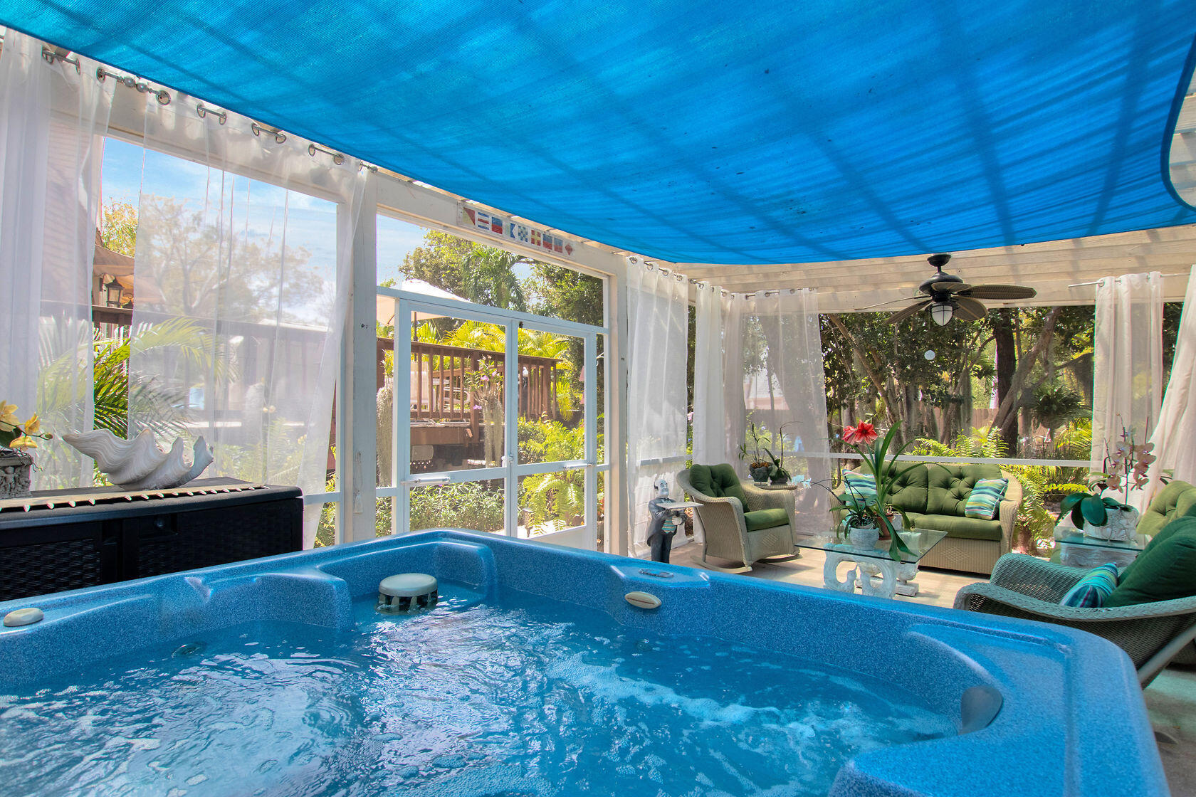 676 Sailfish Trail Key Largo, FL 33037 - Photo 28 of 38 a bed sitting in a spacious bedroom next to a window