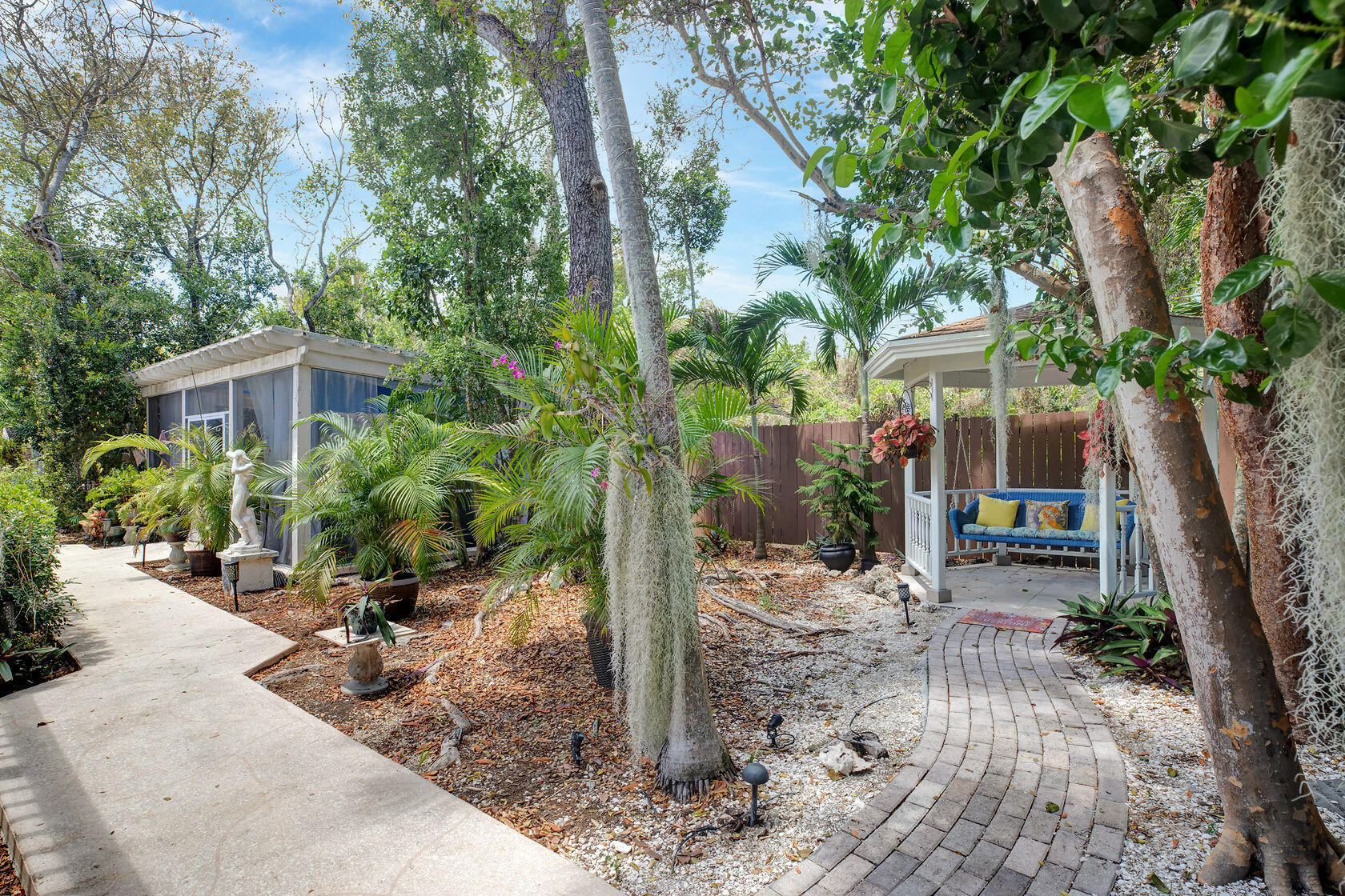 676 Sailfish Trail Key Largo, FL 33037 - Photo 36 of 38 a view of a house with backyard and sitting area