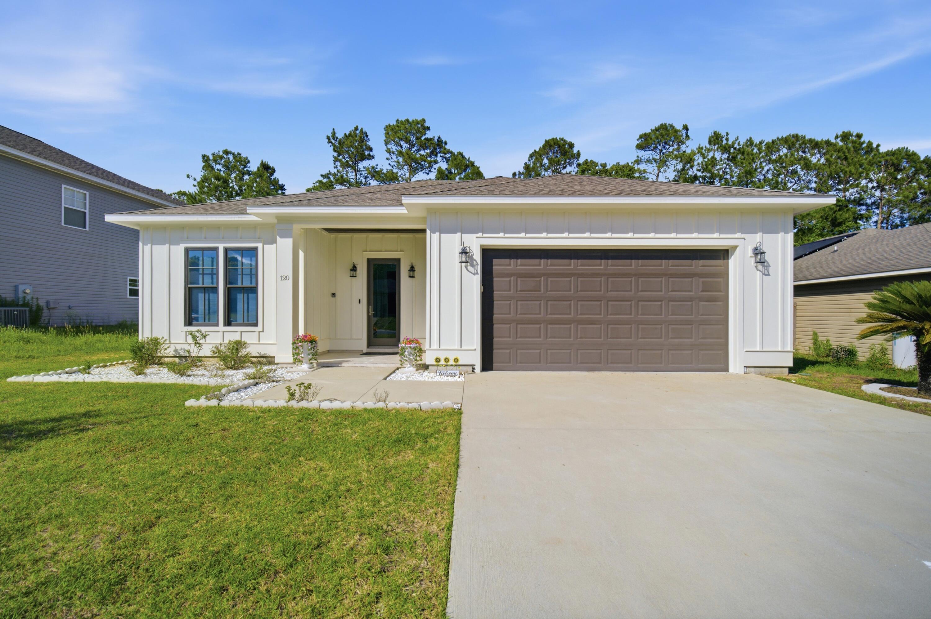 120 Lillian Way Crestview, FL 32536 - Photo 1 of 67 a front view of a house with garden